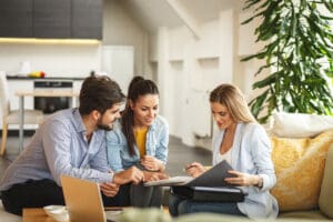 Image of a Dublin Relocation service provider meeting with two renters in a Dublin Apartment.